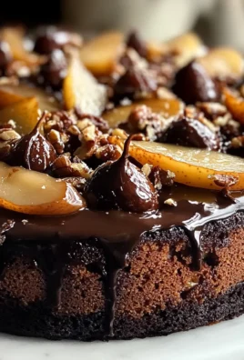 Torta cioccolato, frutta secca e pere