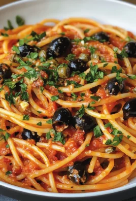 Spaghetti gustosi con olive nere