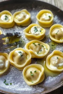 Cappellacci ripieni di ricotta, erba cipollina e lime